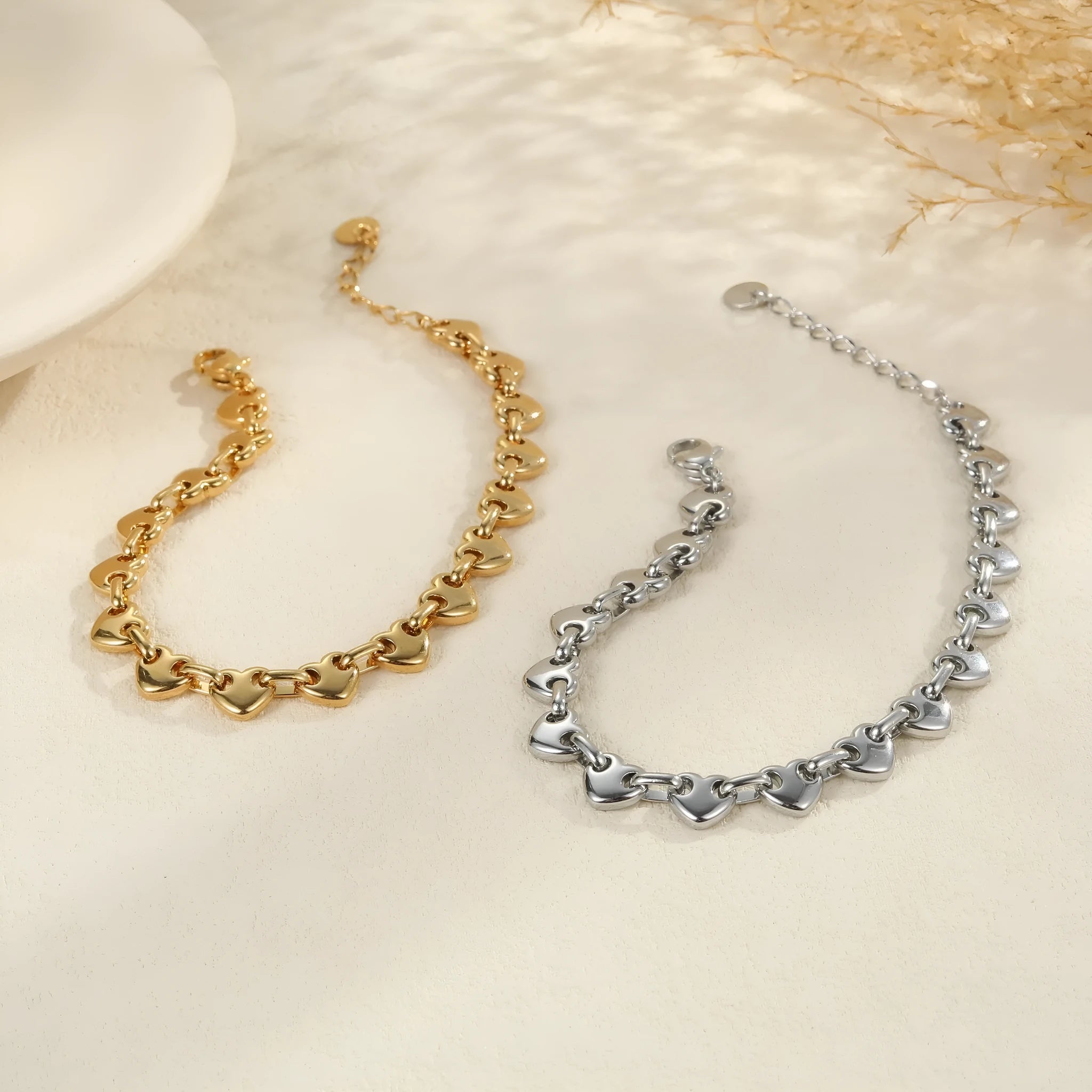Stainless steel hollowed-out heart bracelet with electroplated finish in gold, steel or colour block options.