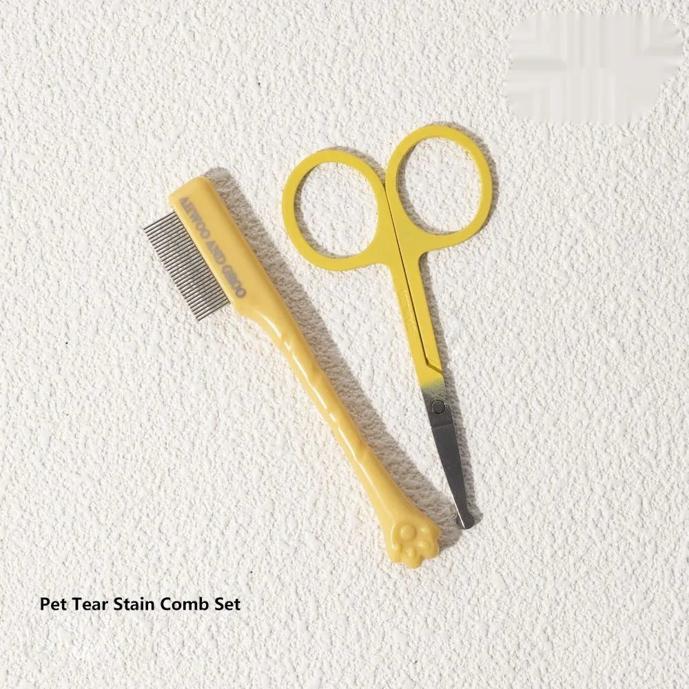 Black ABS plastic pet tear stain comb and scissors set on white background