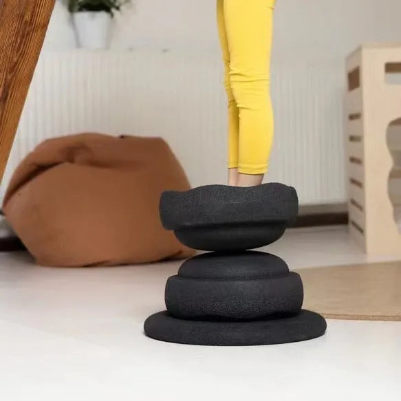 Plastic wood surf balance board for children, shown in mixed colour and black wood grain finishes.