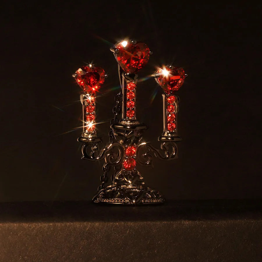 Gothic style zinc alloy clavicle chain necklace with a hollow candlestick pendant on a cross chain.
