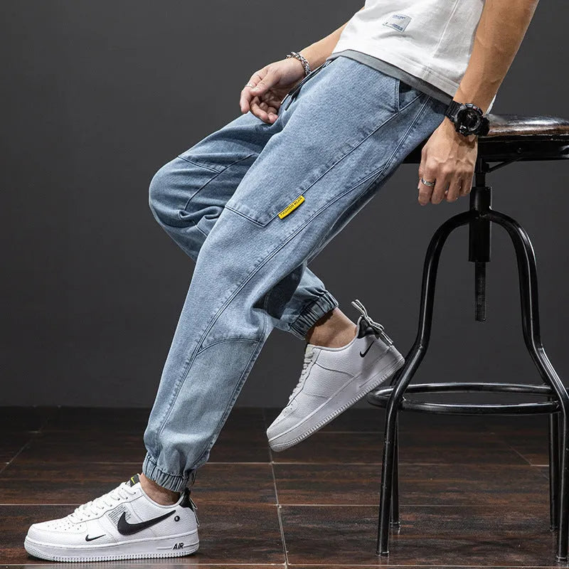 Men's loose fit cargo jeans in Korean style, showing straight leg and mid-waist design.
