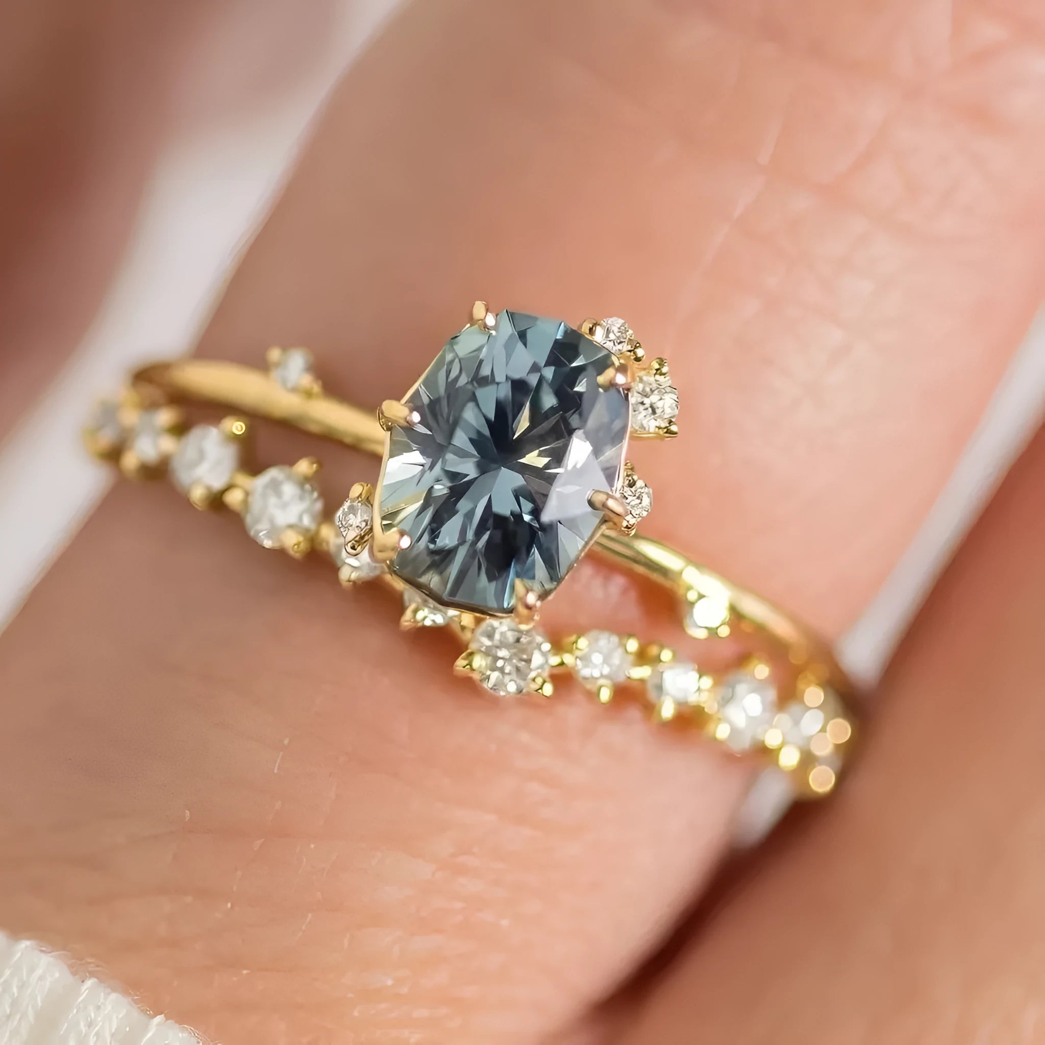Gold plated women's ring with flower design and green zircon stones showing five available ring sizes