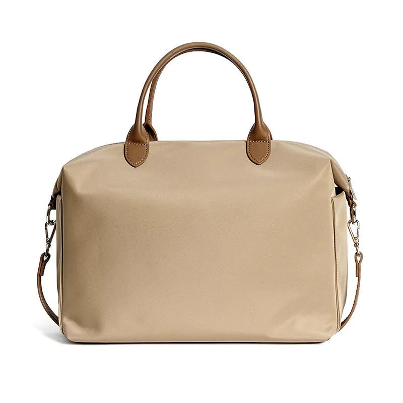 Nylon waterproof shoulder bag in black or light khaki colour measuring 35cm wide