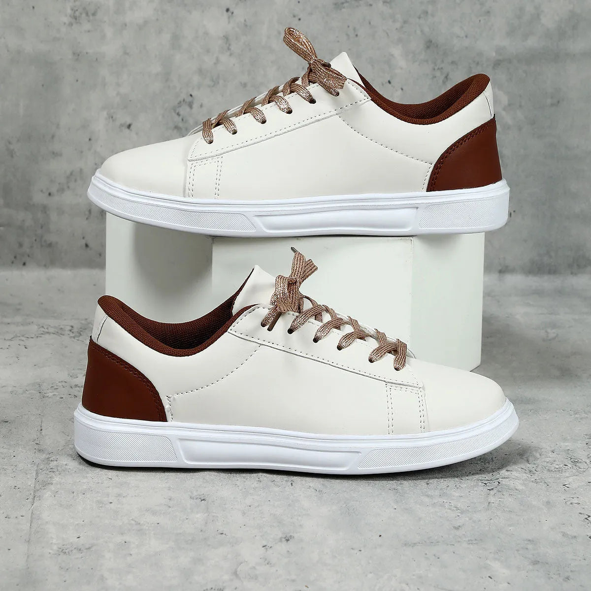 Women's beige brown platform skateboard sneakers with a cross strap and flat rubber sole.