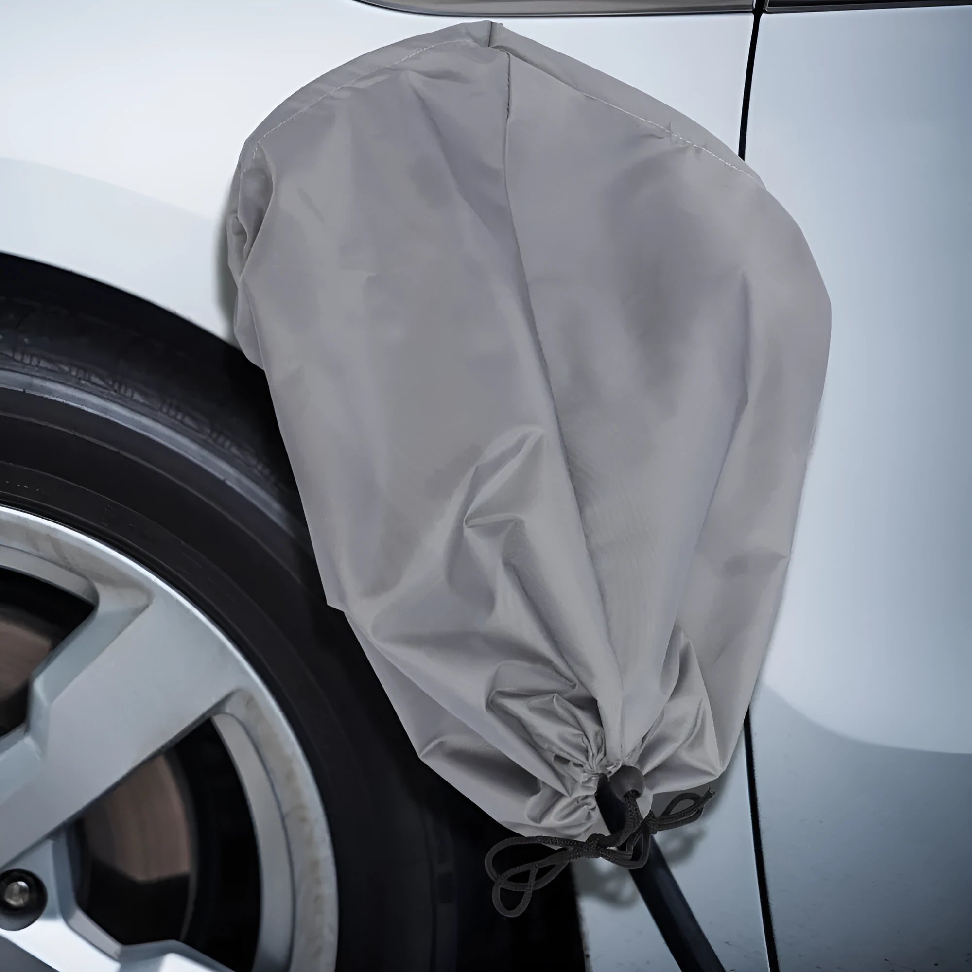 Grey waterproof cover for electric vehicle charging point with drawstring closure