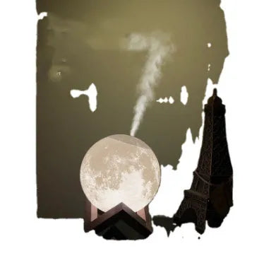 Spherical moon humidifier with LED night light on a bedside table, showing USB charging cable