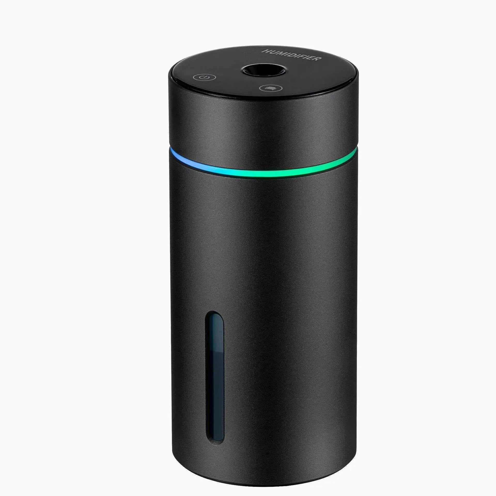 Black aluminium car humidifier and essential oil diffuser with night light on a desk next to USB cable.