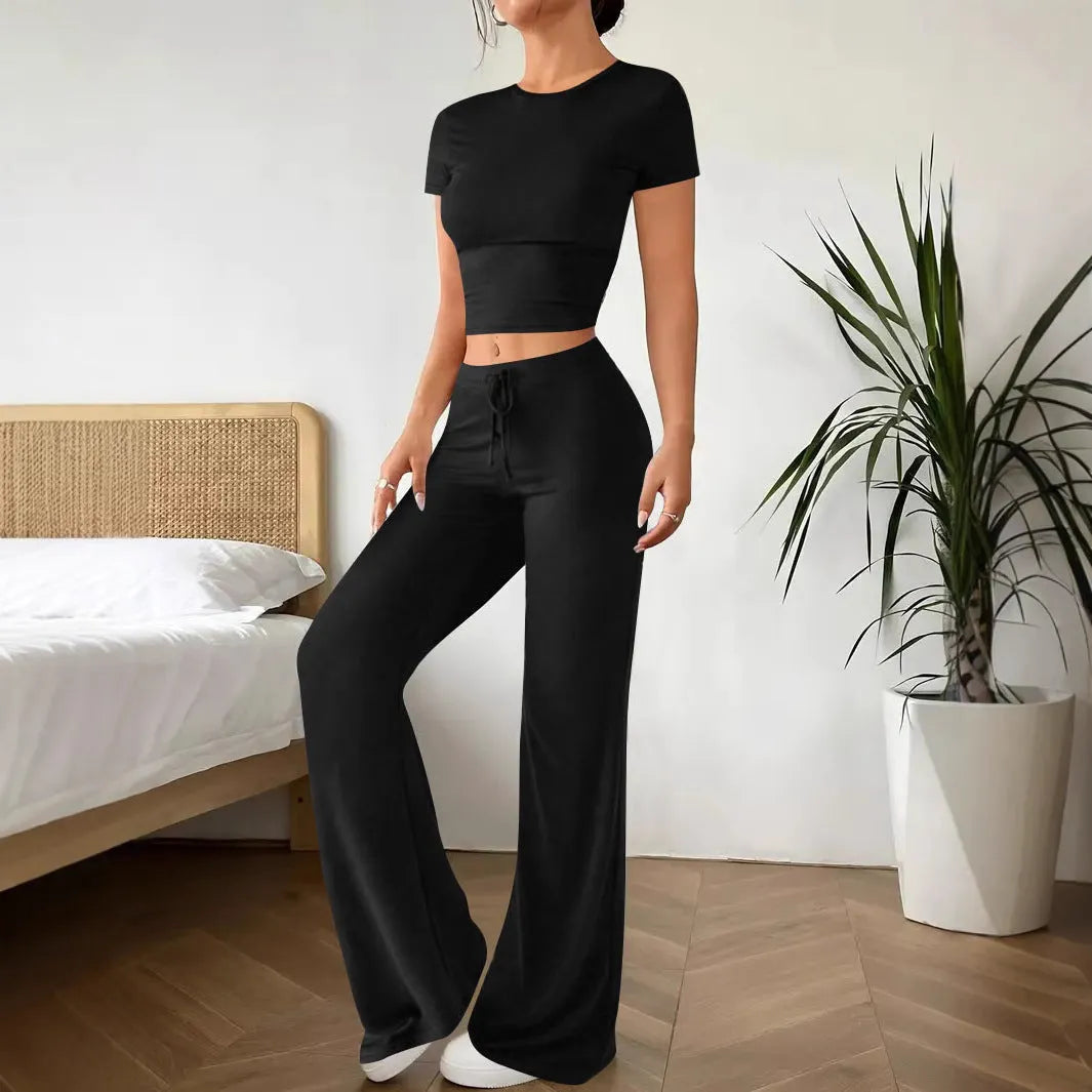 Black polyester women's high waist trousers and short sleeve t-shirt suit on hanger