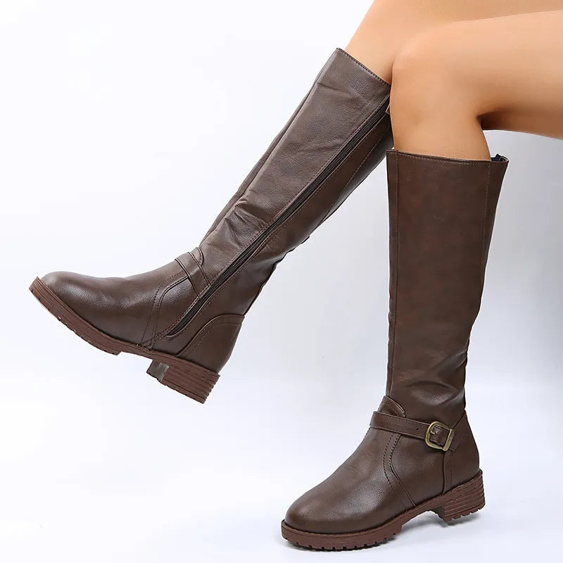 Women's black knight boots with a square heel, round toe, and decorative buckle.