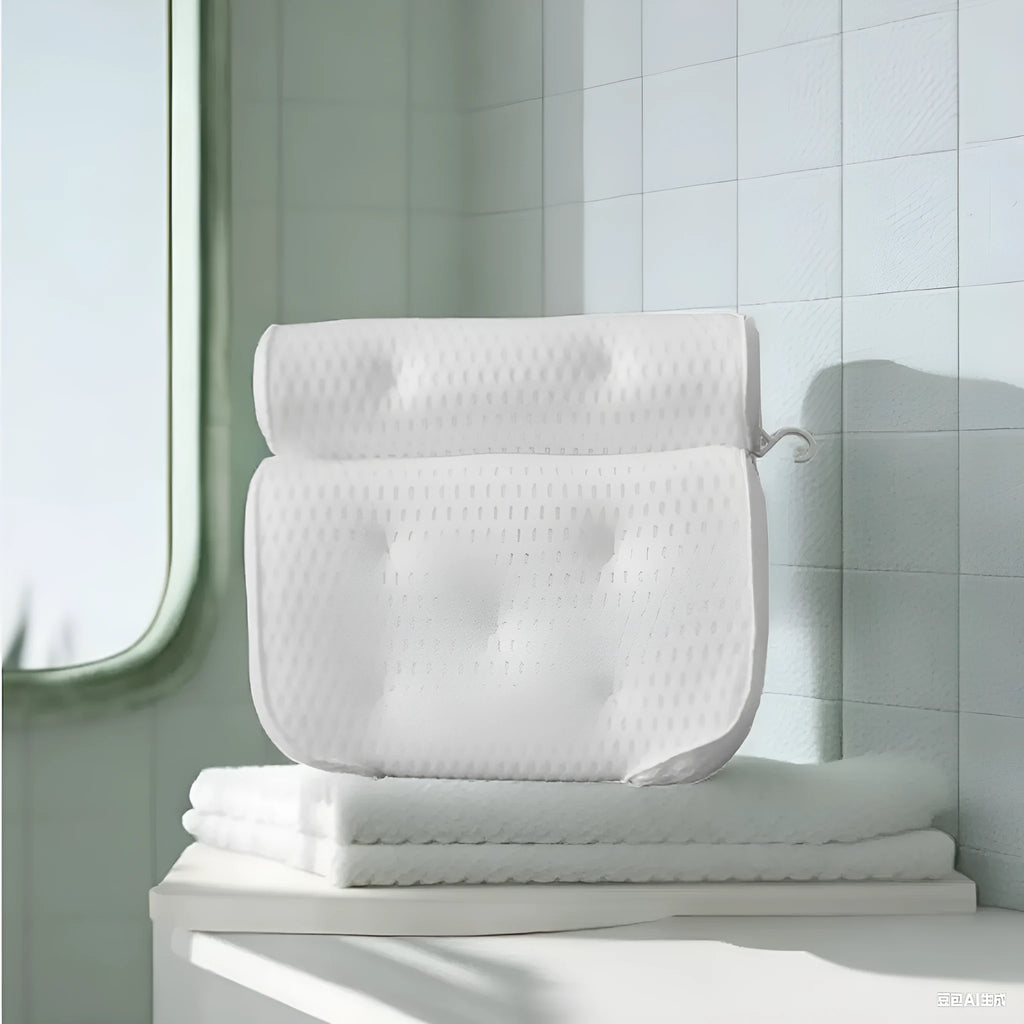 White bathtub pillow with mesh fabric and suction cups on a bath mat.