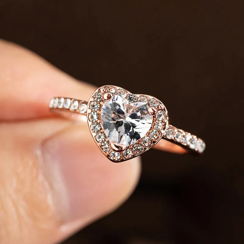 Women's heart-shaped crystal wedding ring with electroplated rose gold finish on white copper