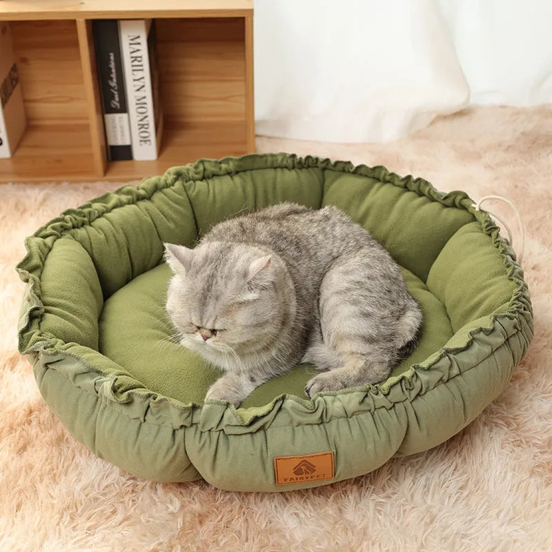 Grey and green reversible donut-shaped pet bed for cats and dogs, shown in small, medium, and large sizes.