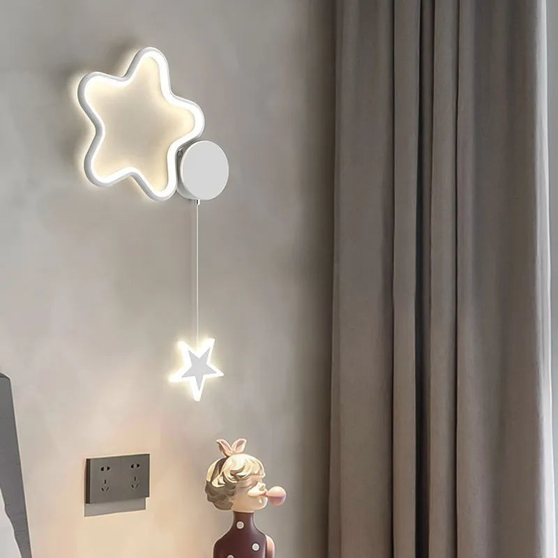 Children's cloud and star themed LED bedside wall lamp in black or white.