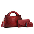 Women's square black crocodile pattern PU leather crossbody handbag with a single strap and outer pockets.