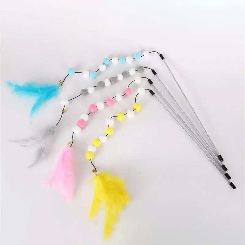 Colourful cat teaser stick with acrylic pompons and feather attachments measuring 31cm long