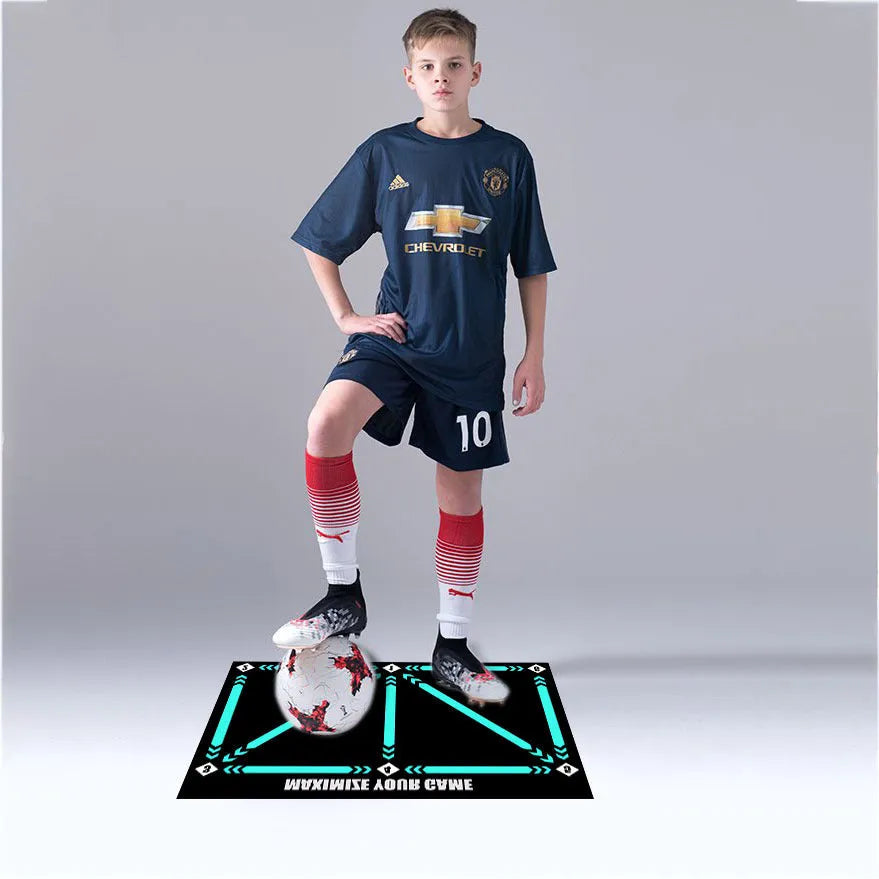 Black rectangular football training mat on floor for ball control practice drills