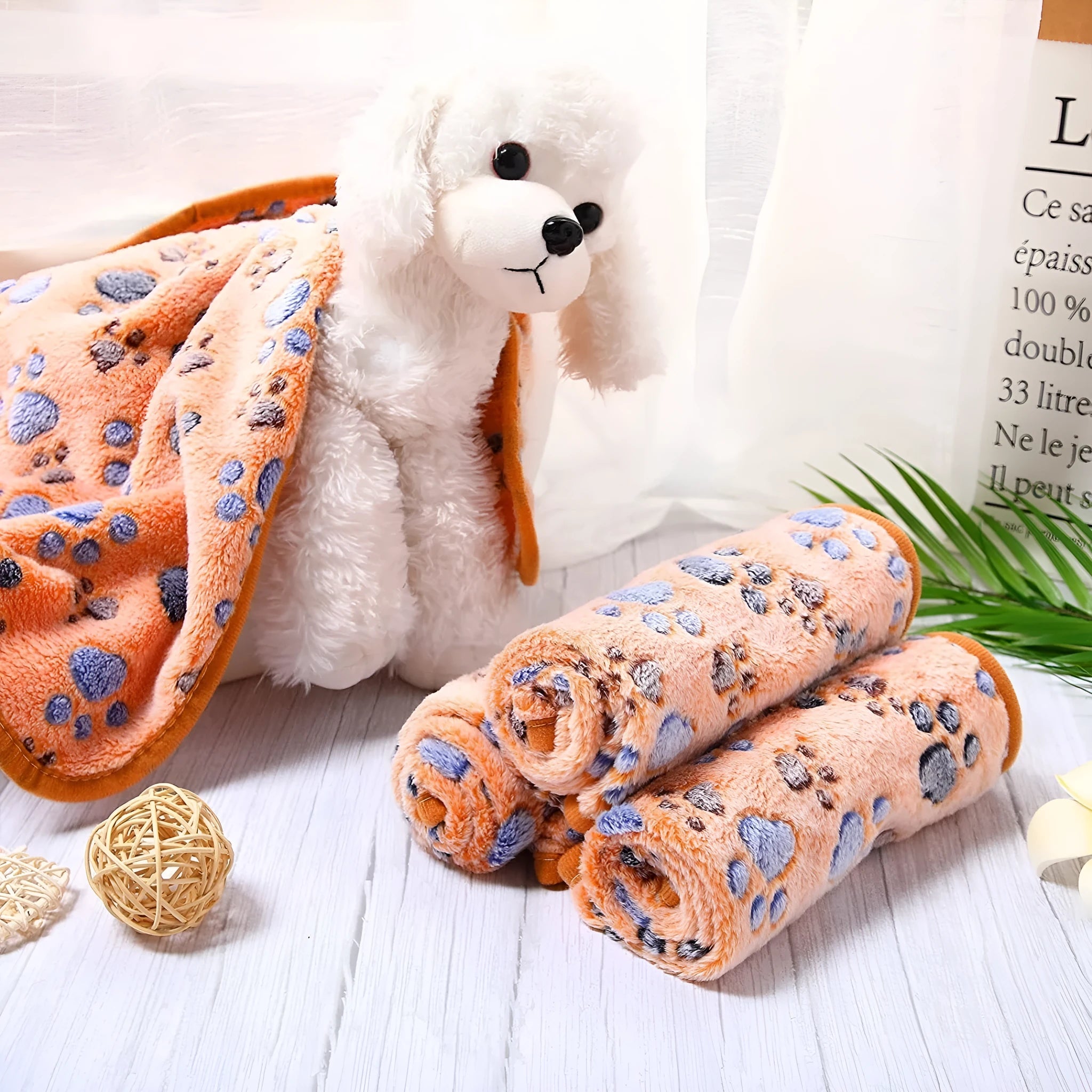 Coral fleece dog blanket with paw print design, shown in camel colour, size L (100x120 cm).