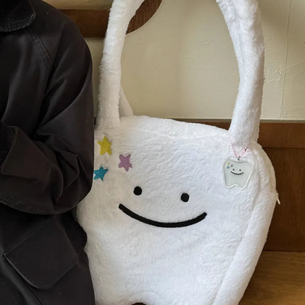 White plush shoulder tote bag with cute teeth pattern design and zipper closure
