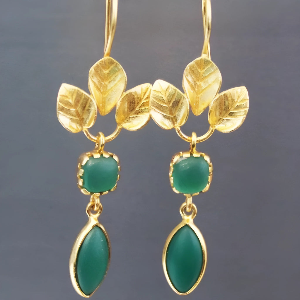 Gold tone retro drop earrings with a French leaves tassel and zircon detail.