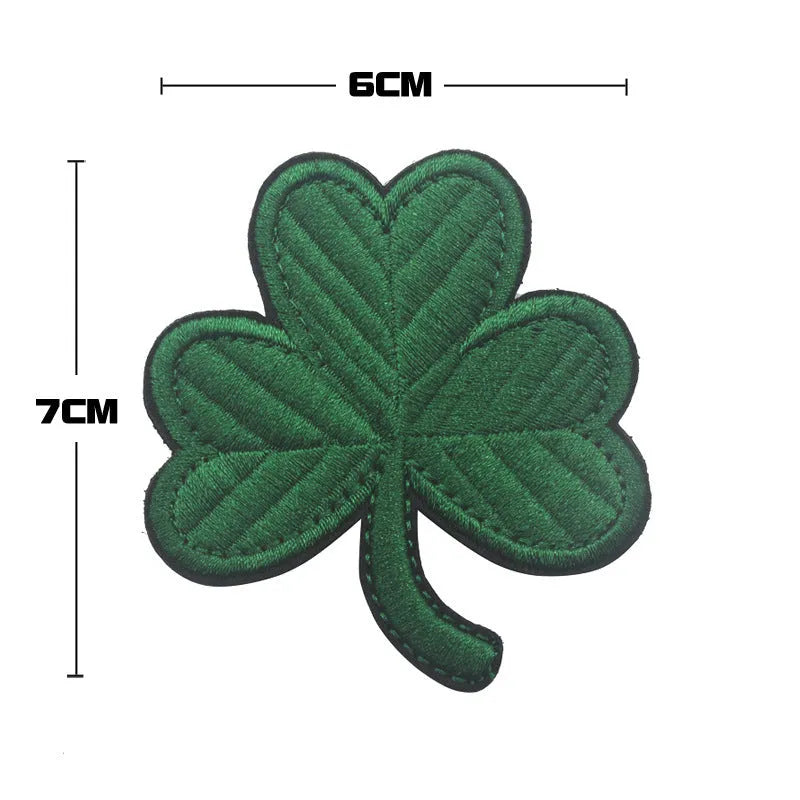 Embroidered fabric badge with Velcro backing showing detailed embroidery on nylon polyester material