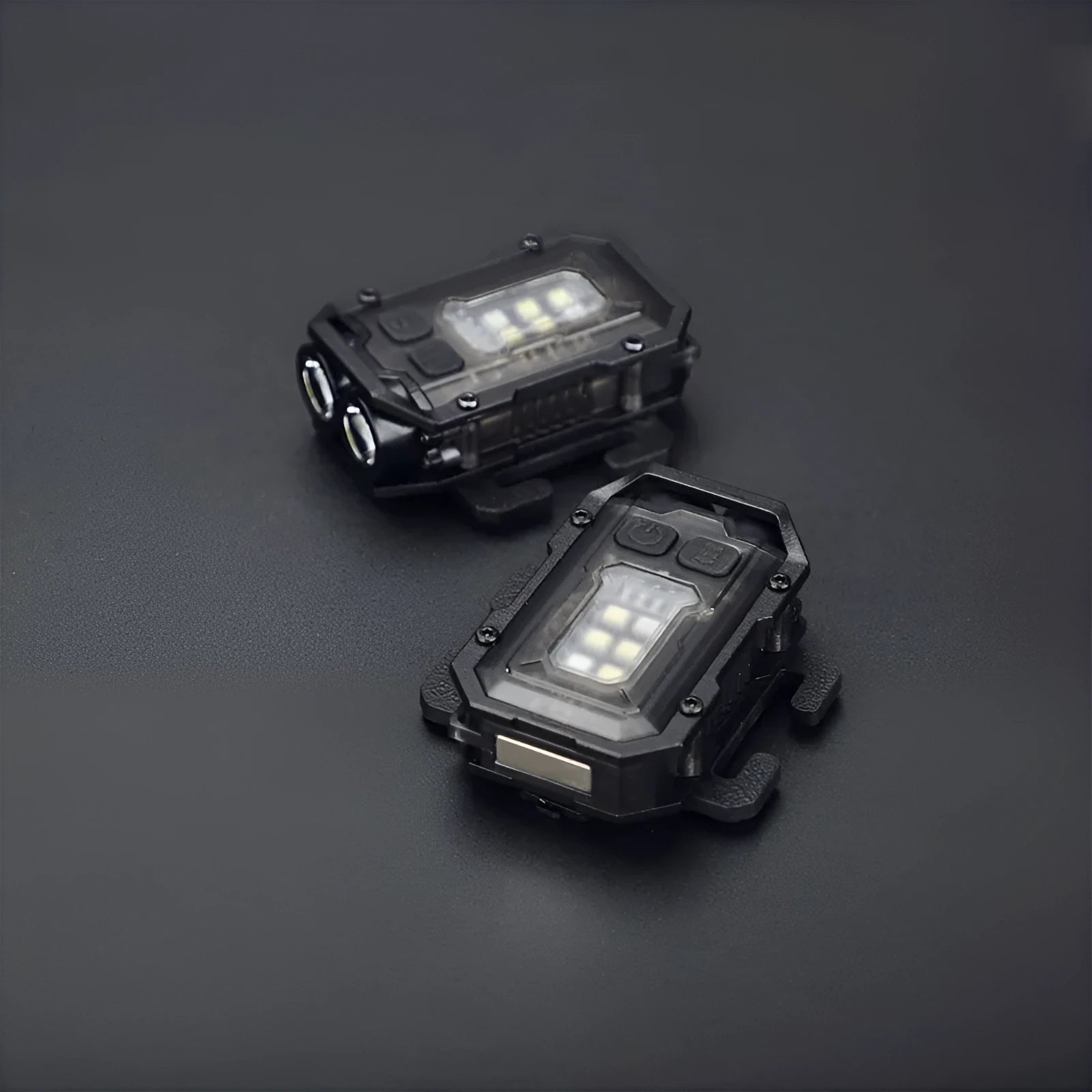 Mini black tactical warning flashlight with USB charging cable for backpack mounting.
