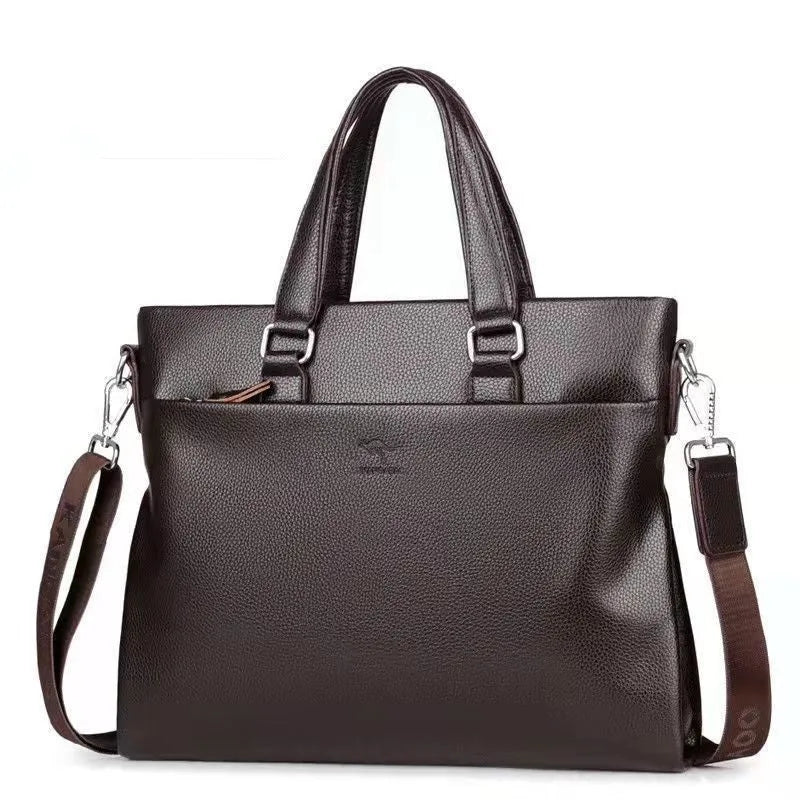 Black PU leather men's shoulder messenger bag with splicing style, shown next to a laptop