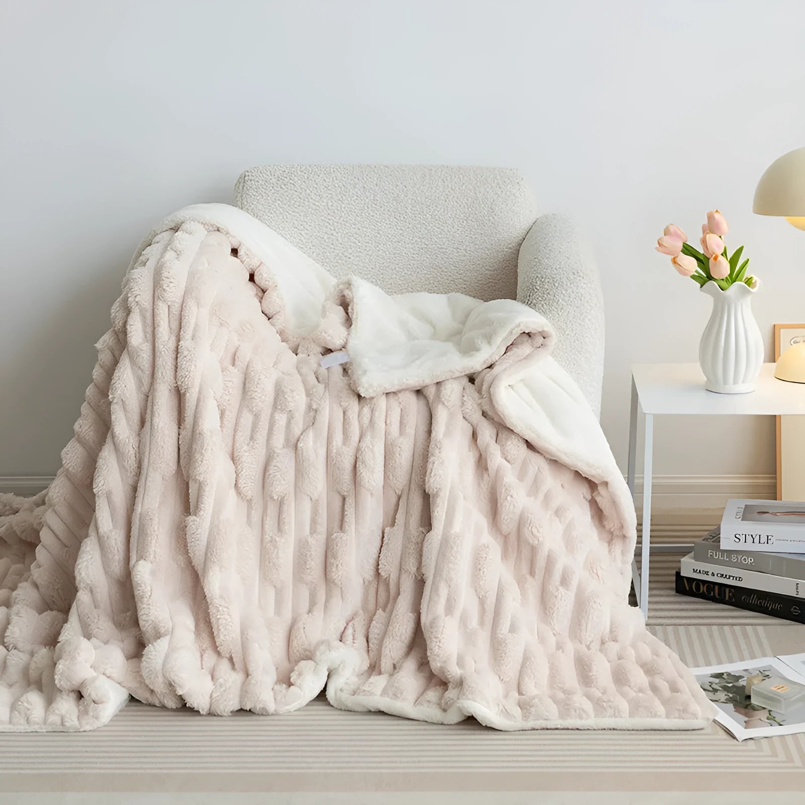 Rabbit Bejirog solid colour polyester fibre flange blanket on a bed, available in multiple sizes and colours