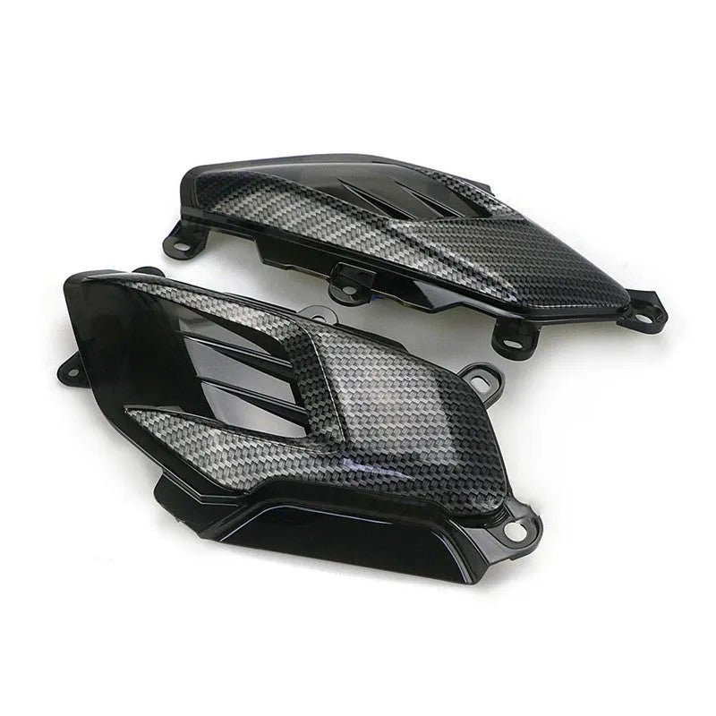 Pair of Yamaha NMAX carbon fibre LED side lamps showing blue and red light options