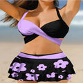 Women's purple high waist lace-up bikini swimsuit set with matching skirt on a white background.