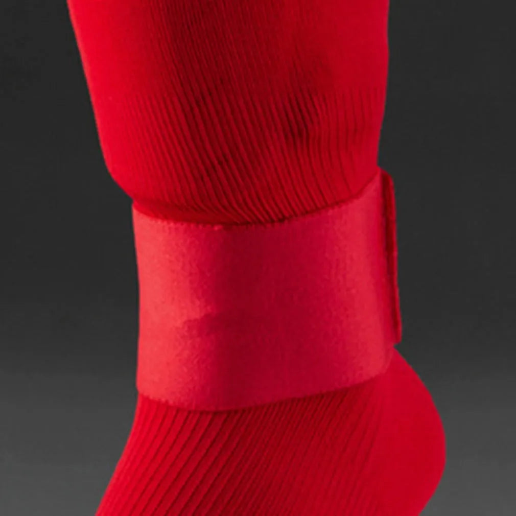 Elastic rubber shin guard strap for football and sports in red, blue, black, white colours.