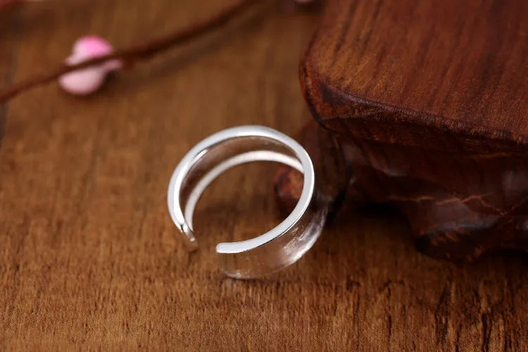 Adjustable geometric open ring with a Korean frosted sterling silver finish.