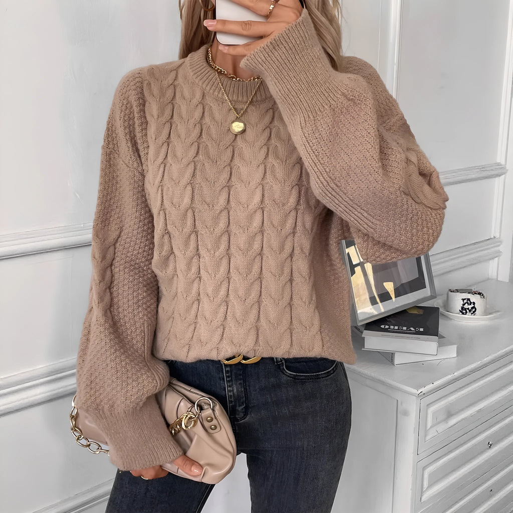 Women's beige loose sweater with round neck and twisted yarn detail on solid polyester fabric