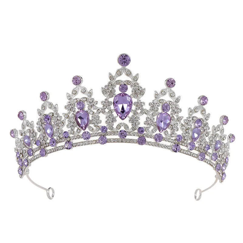Baroque-style bride crown headdress made of alloy with rhinestone decoration in silver and gold colour options.