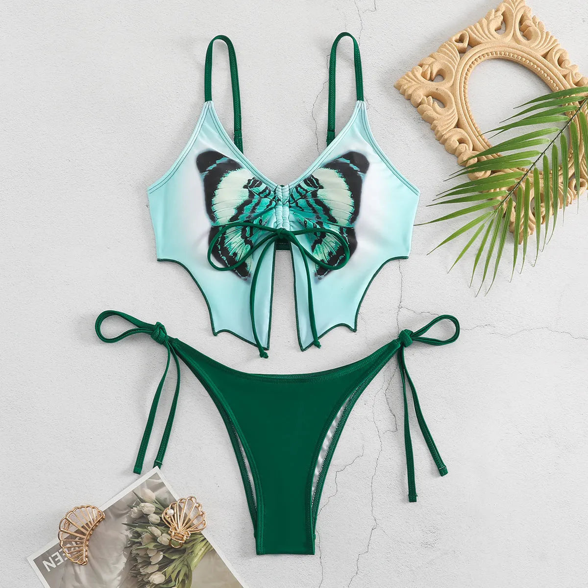 Women's purple bikini suit with bow ins style detail on a split design, made from polyester fabric.