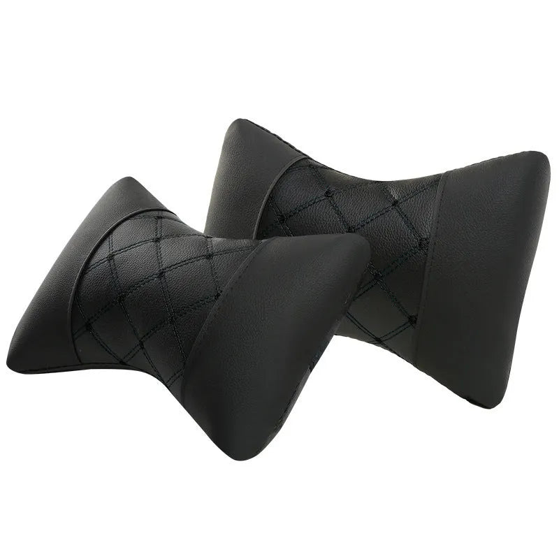 Black quilted car headrest neck pillow with diamond pattern and contrasting stitching