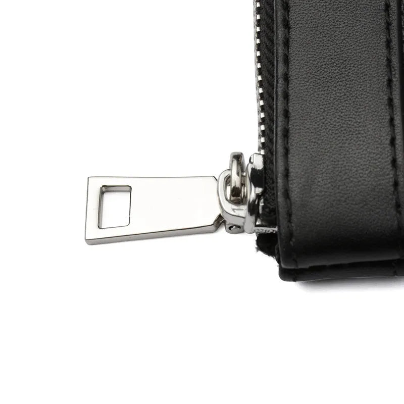 Black plaid patterned men's leather clutch wallet showing front view.