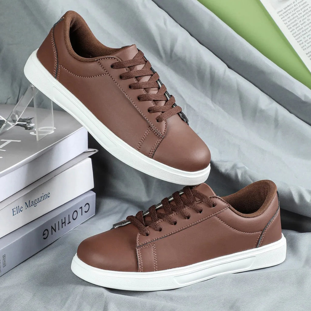 Women's beige brown platform skateboard sneakers with a cross strap and flat rubber sole.