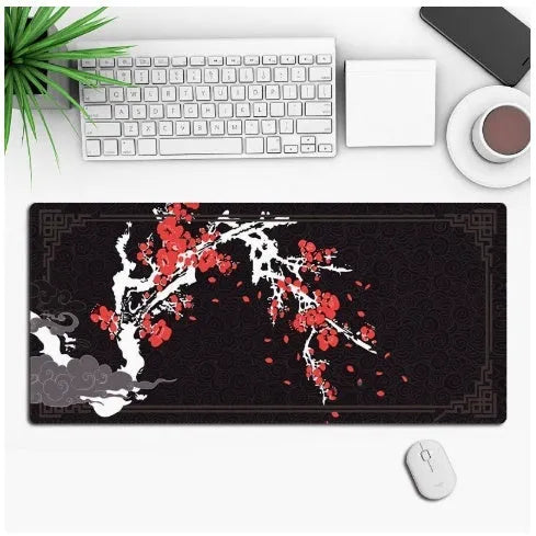 Large custom anime print gaming mouse pad on a desk with keyboard and mouse.