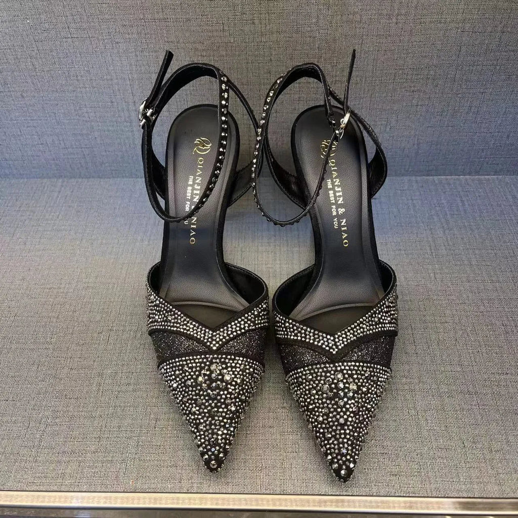 Women's black high heels with hollow stiletto heels and red soles, pointed toe design