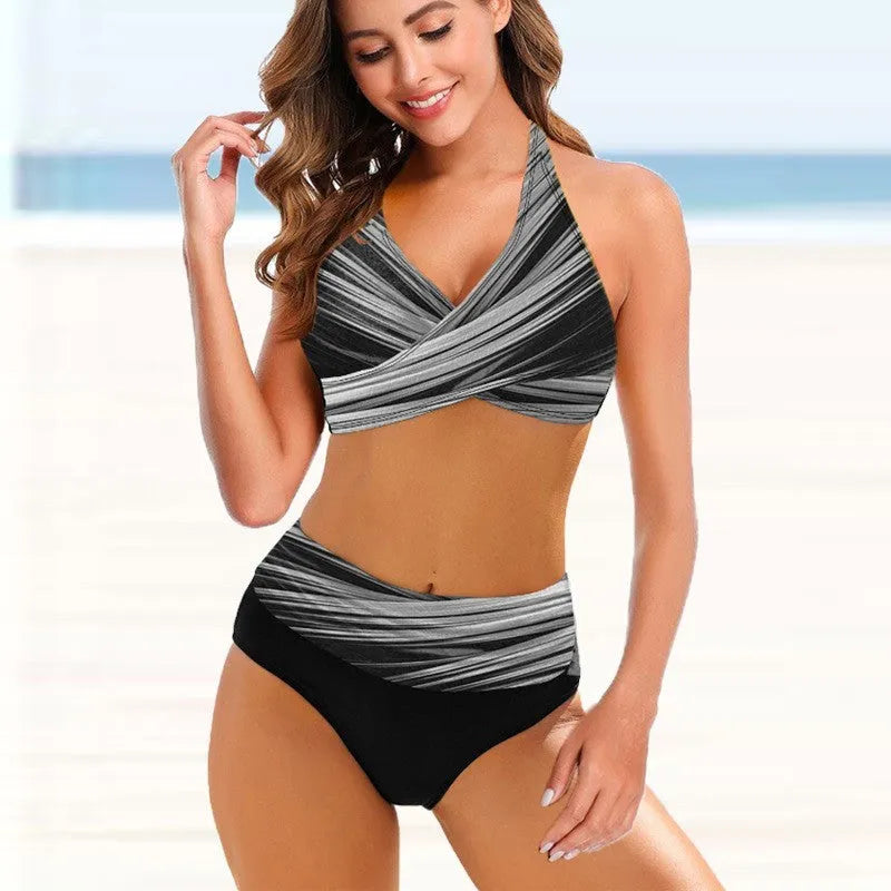 Ladies striped tie-dye hollow bikini set with high-waisted briefs on a mannequin.