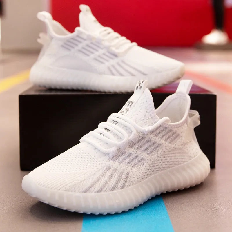 Men's white breathable flying fabric sports shoes with mesh lining and a low-platform sole.