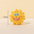 Set of four coloured natural latex rubber squeaky dog balls with bump-textured surfaces