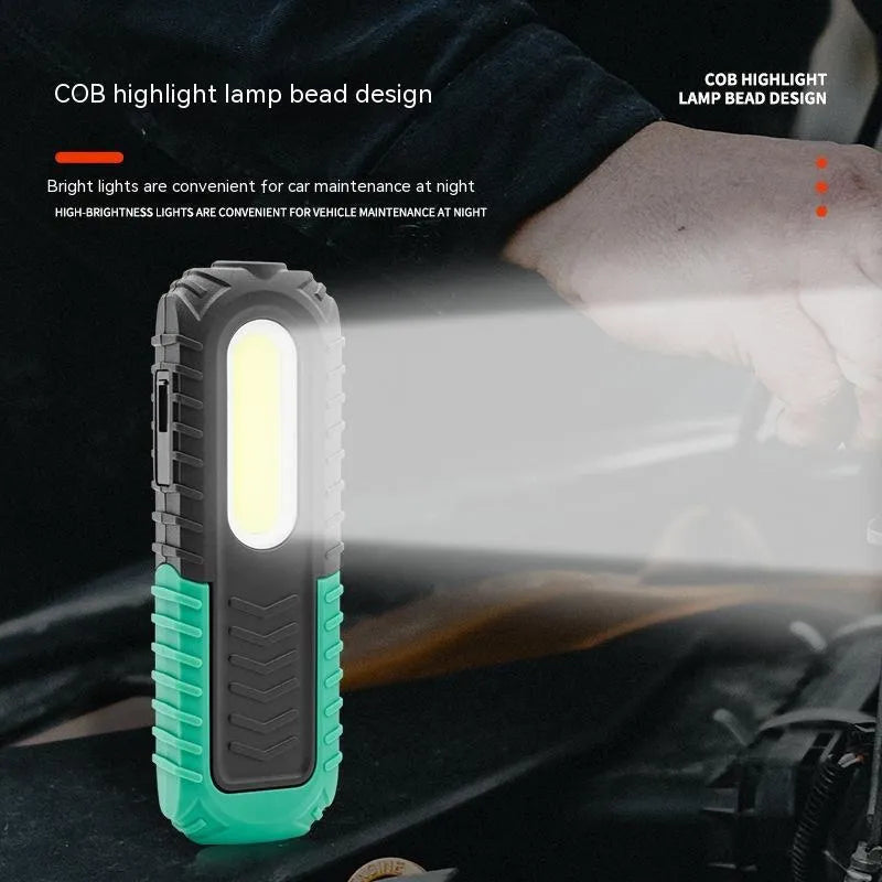 Black and green auto repair work light with USB charging cable