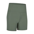 Women's tight-fit cotton blend sports shorts in short fifth pants length on a neutral background.