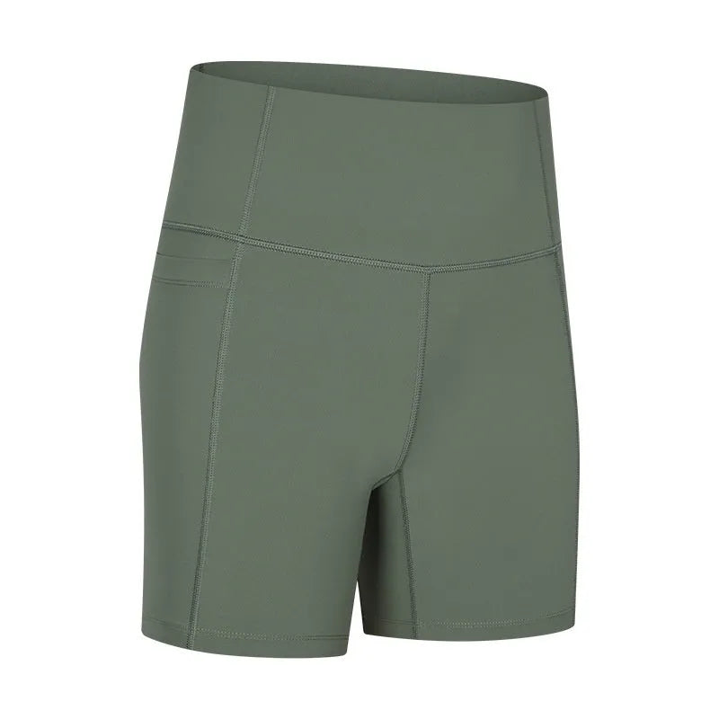Women's tight-fit cotton blend sports shorts in short fifth pants length on a neutral background.