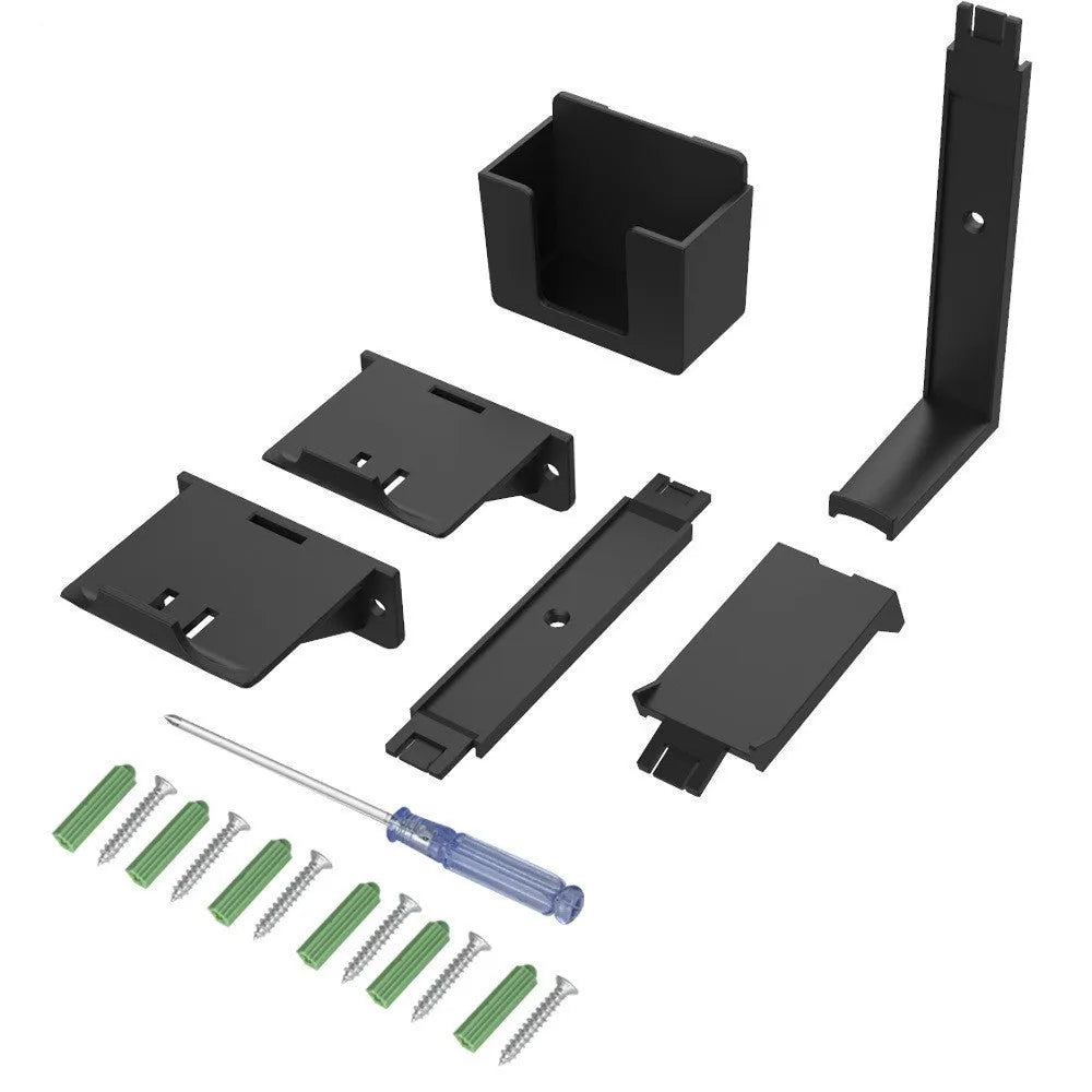White wall-mounted plastic hook holding a black game controller and TV remote.