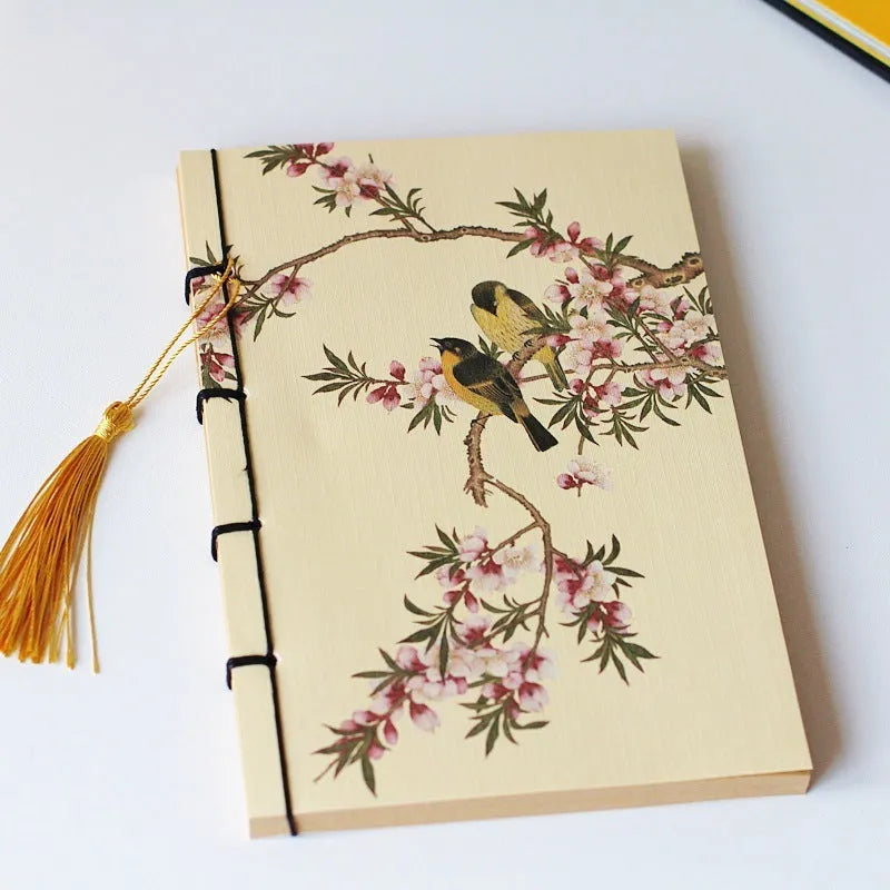 A5 antique art notebook with wire binding, decorative tassels, and traditional Chinese painting cover design