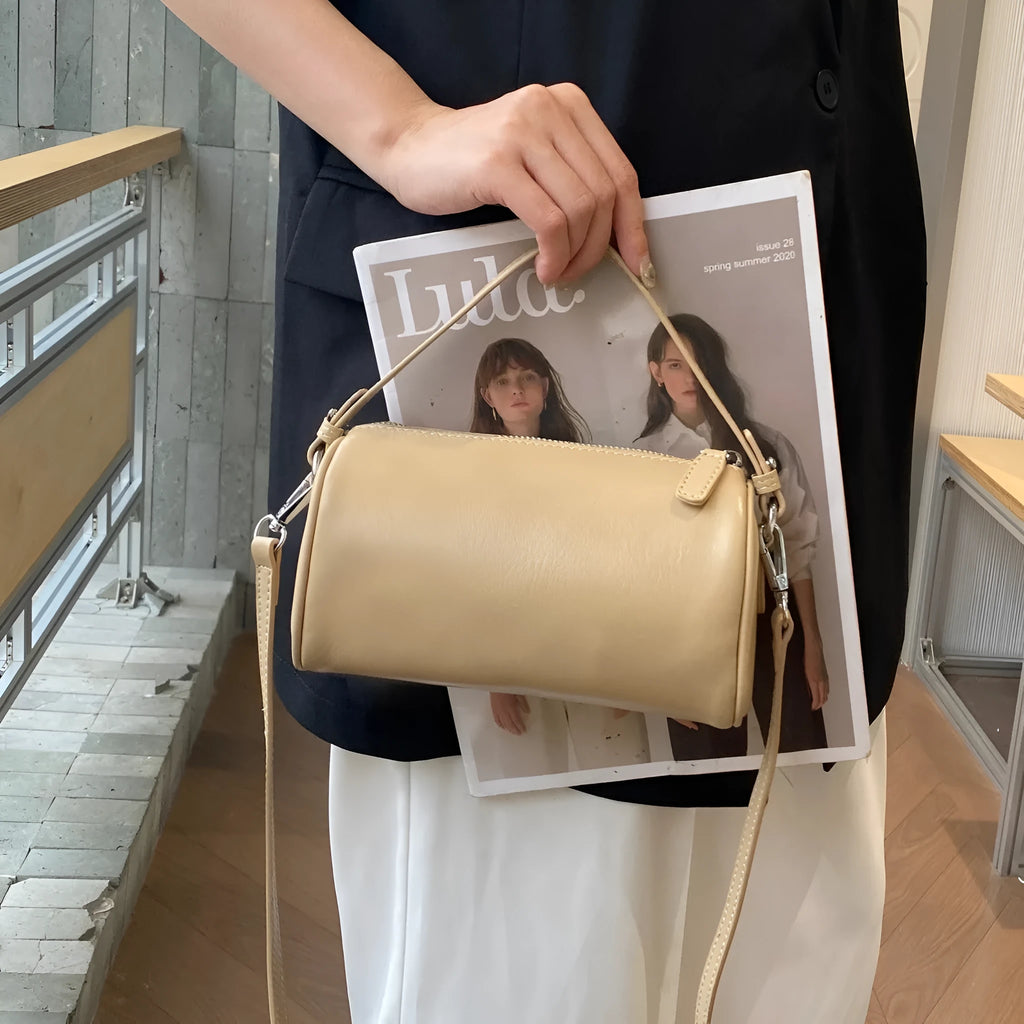 Genuine leather cylindrical crossbody phone bag in vegetable-tanned leather with single shoulder strap