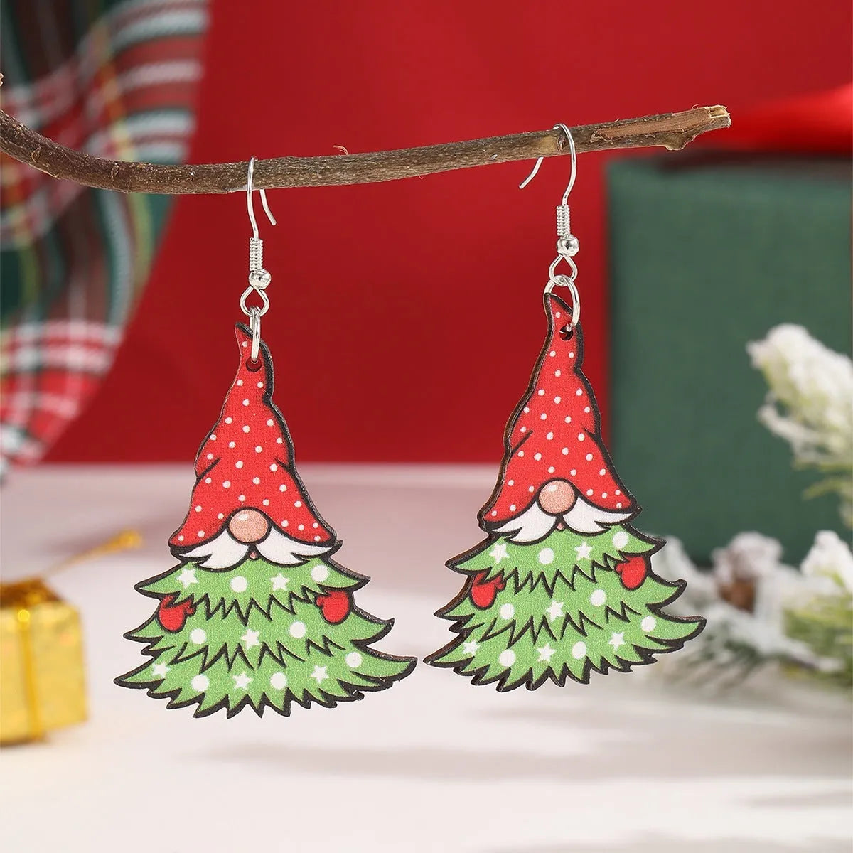 Wooden Christmas earrings showing Christmas tree design and water drop snowman design with festive printing