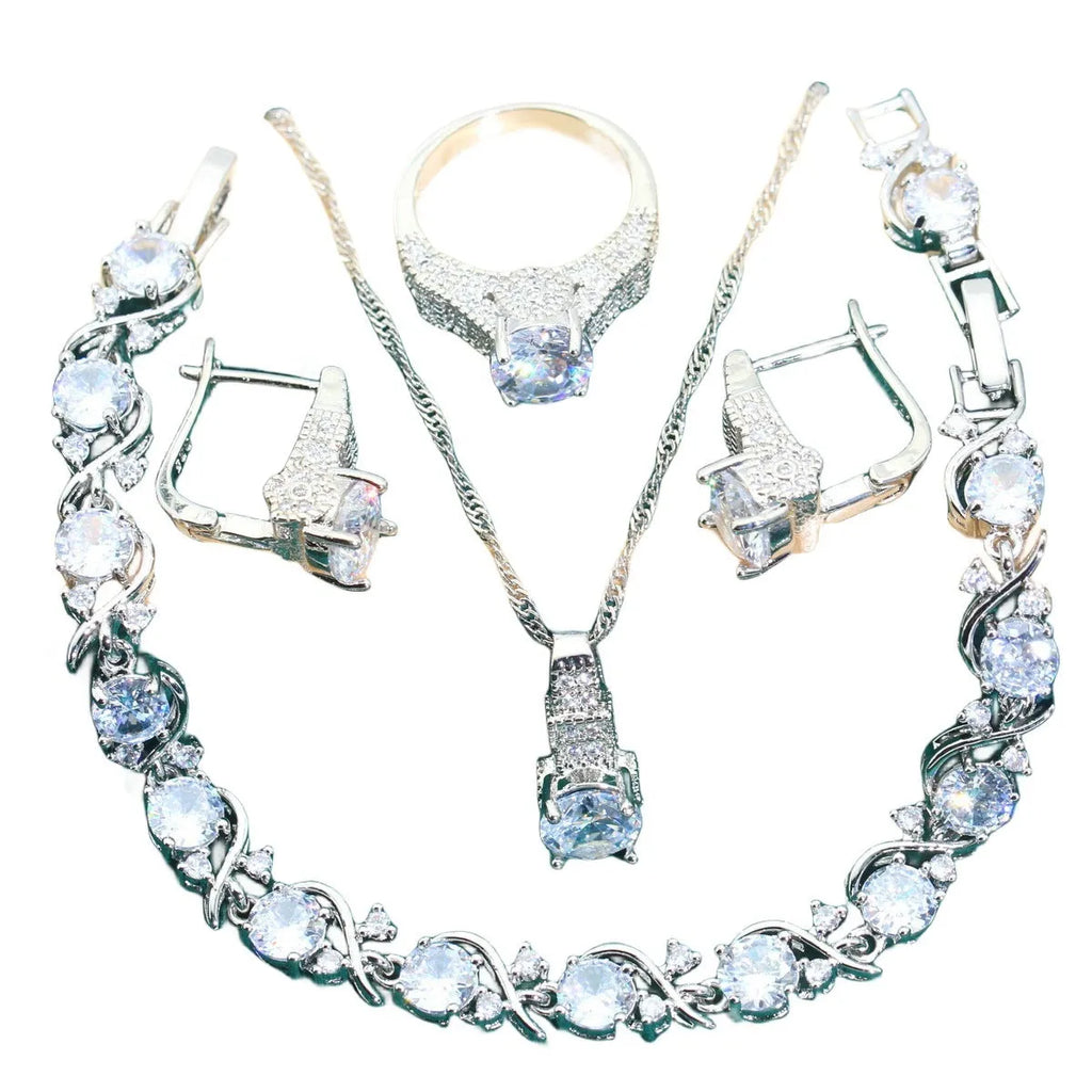 Four-piece bridal jewellery set with water wave chain necklace, bracelet, earrings, and ring in alloy with zircon detailing